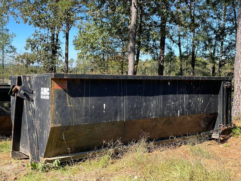 An empty roll-off dumpster ready for a garage cleanout