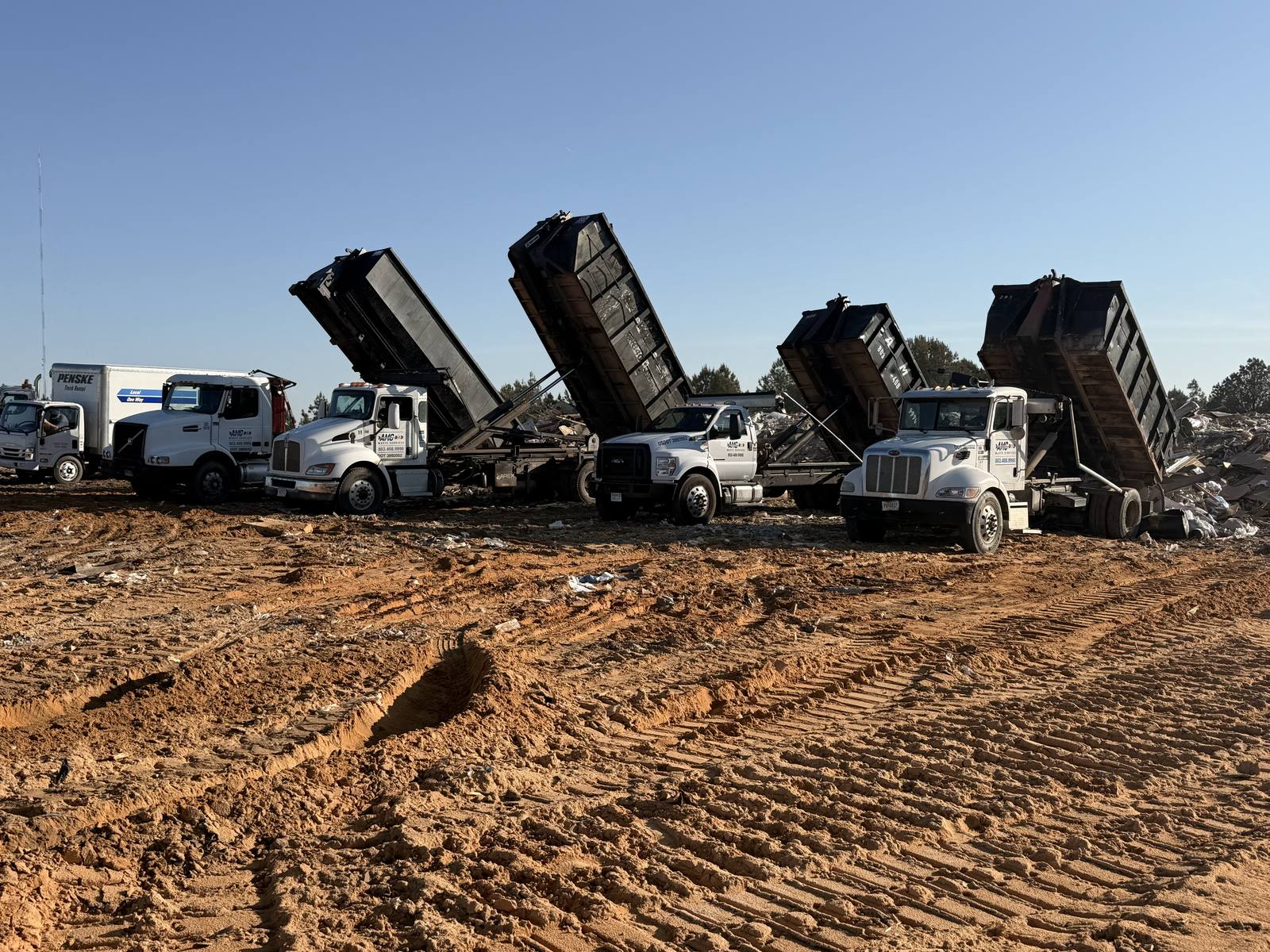 An AMC Waste Services roll-off dumpster on a job in the Columbia, SC Midlands